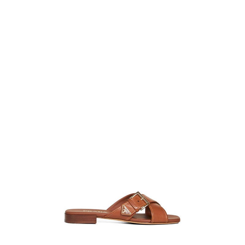 Light tan leather slides with buckle
